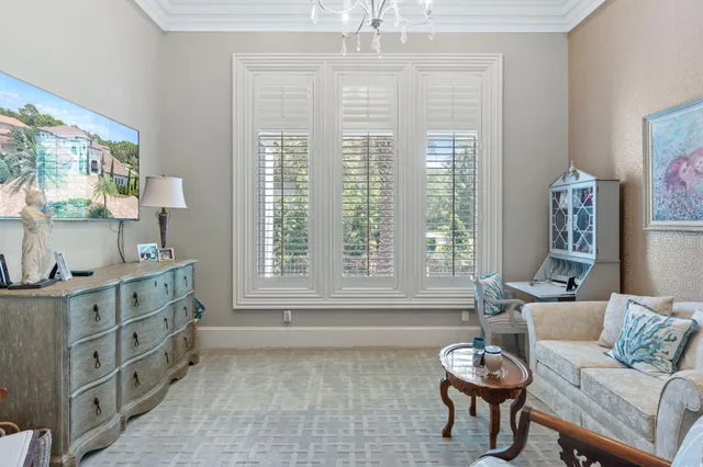 a living room with lots of furniture and a book shelf