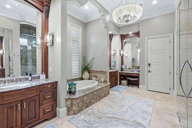 a bedroom with a large bed and a painting on the wall