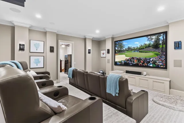 an aerial view of a house with garden space and lake view