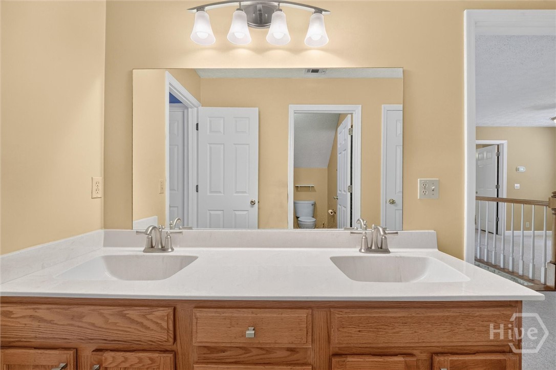 179 Hawk Hammock Road Springfield, GA 31329 - Photo 41 of 67 Jack N jill bathroom upstairs with double vanities