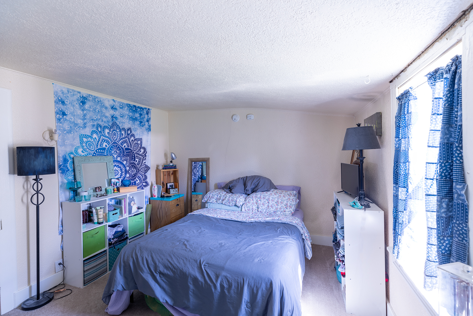 916 North 8th Street Rochelle, IL 61068 - Photo 11 of 16 a bedroom with a bed and a flat tv screen on dresser