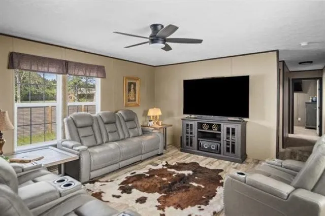 a living room with furniture and a flat screen tv