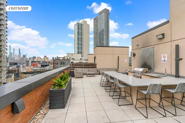 a view of a terrace with furniture and a table