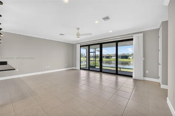 a view of a chandelier fan and entryway