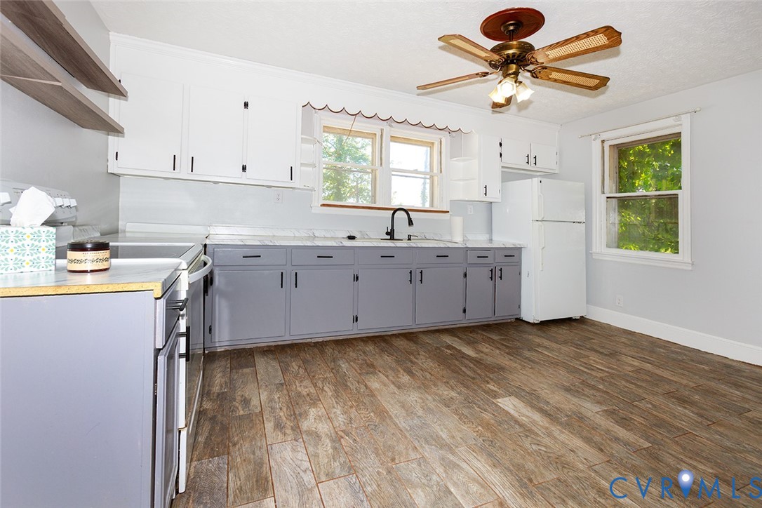 9903 Boze Road Ford, VA 23850 - Photo 10 of 45 a kitchen with granite countertop a sink stainless steel appliances and cabinets