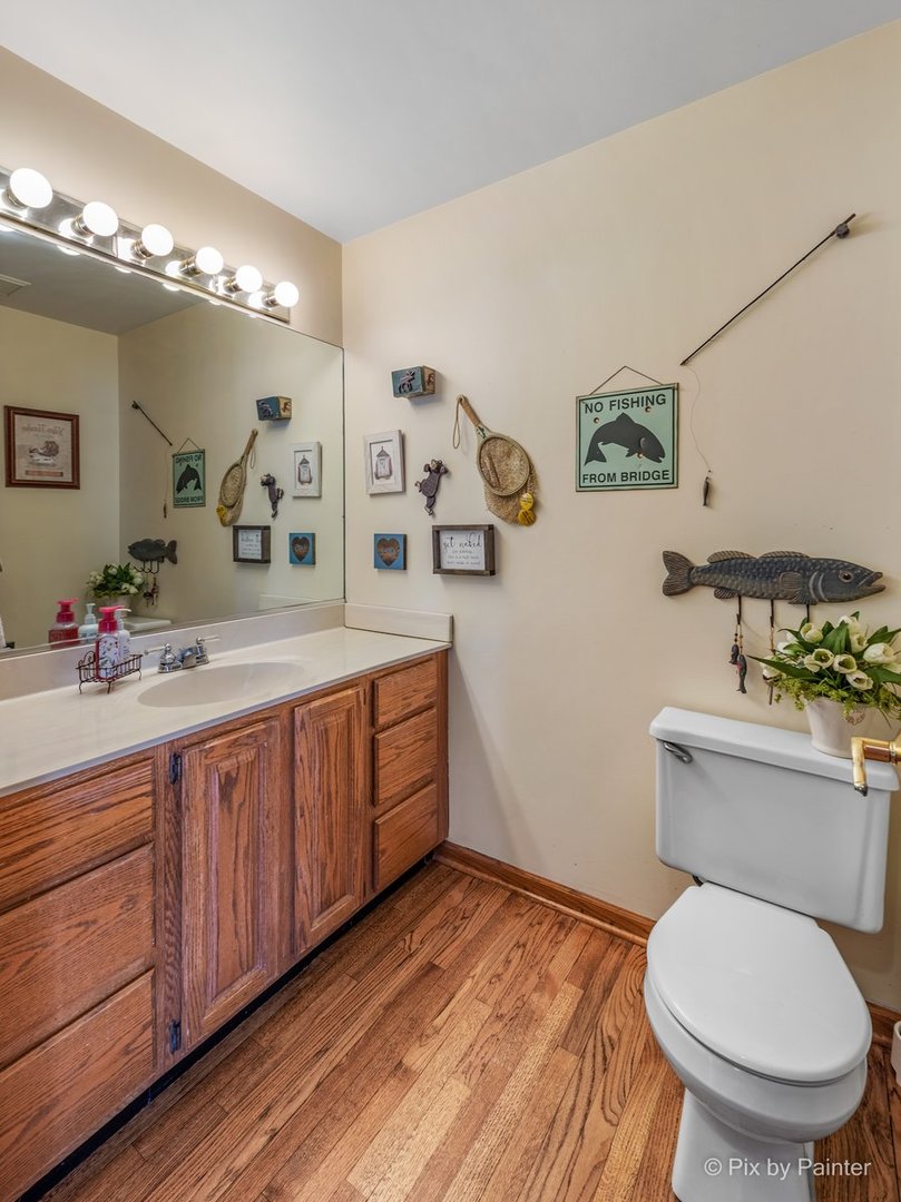 120 Briargate Road Cary, IL 60013 - Photo 29 of 35 a bathroom with a granite countertop toilet sink and mirror
