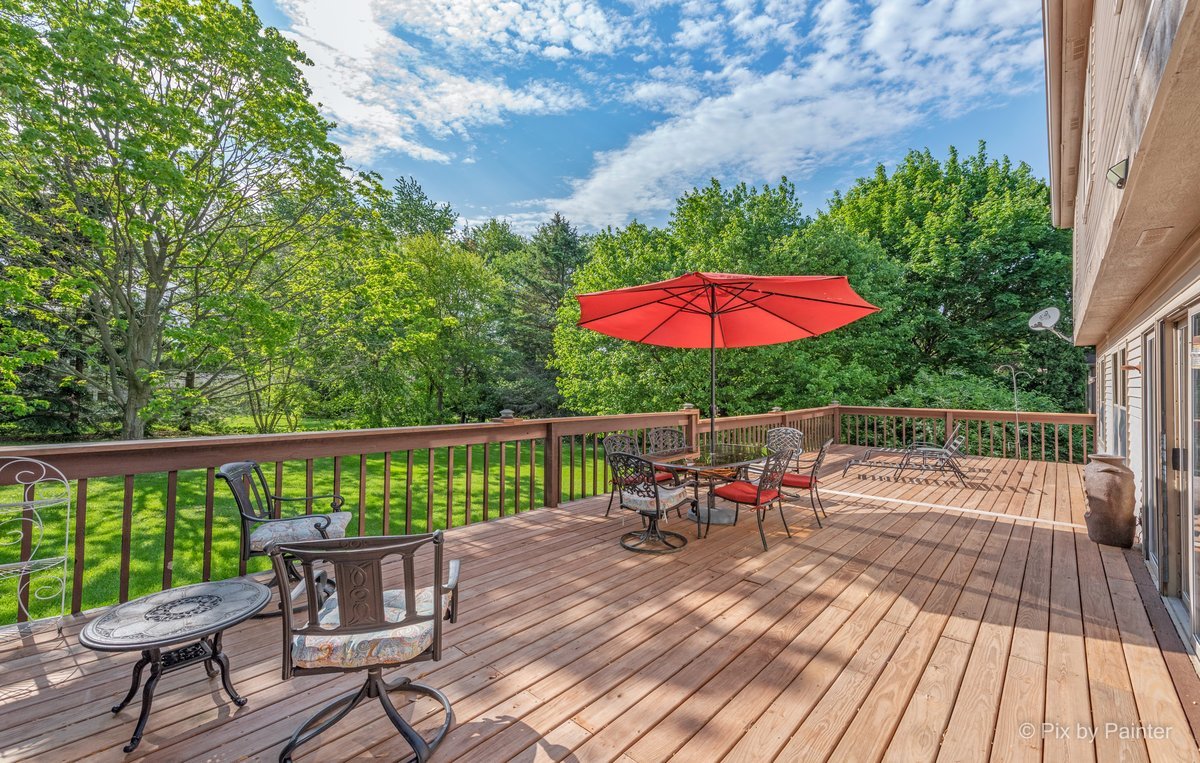 120 Briargate Road Cary, IL 60013 - Photo 31 of 35 a view of a deck with furniture and a garden