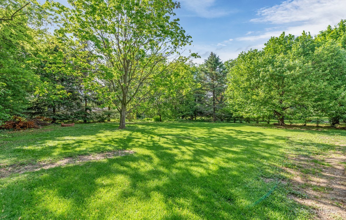 120 Briargate Road Cary, IL 60013 - Photo 34 of 35 a view of outdoor space with deck and yard