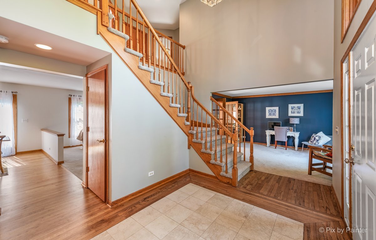 120 Briargate Road Cary, IL 60013 - Photo 4 of 35 a view of entryway and hall with wooden floor