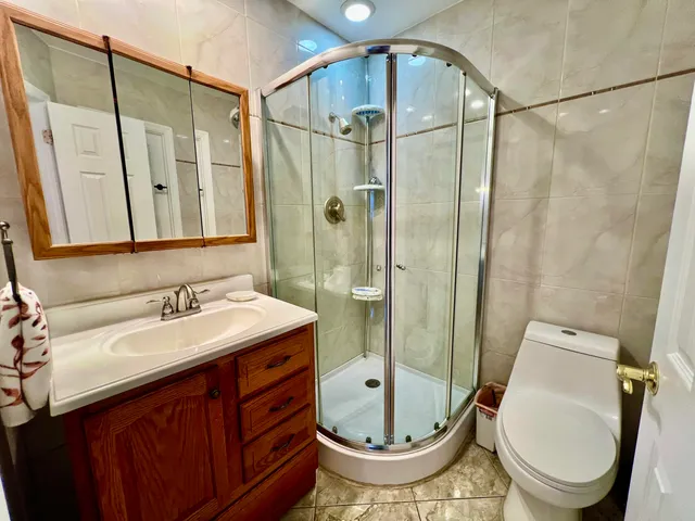 a front view of a house with a yard and fountain