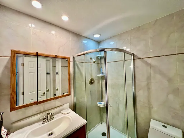 a view of yard with seating area and trees around