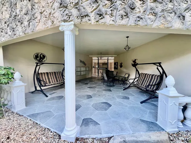 a living room with furniture gym equipment and a flat screen tv