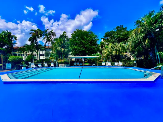 a bathroom with a shower and a mirror
