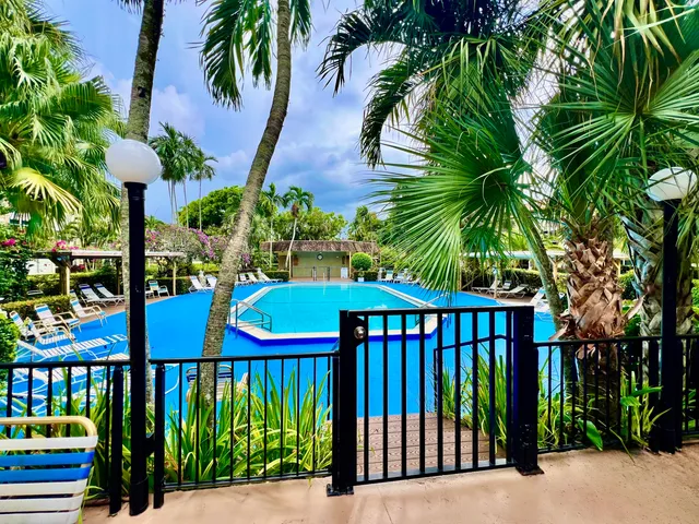 a view of a house with a backyard porch and sitting area
