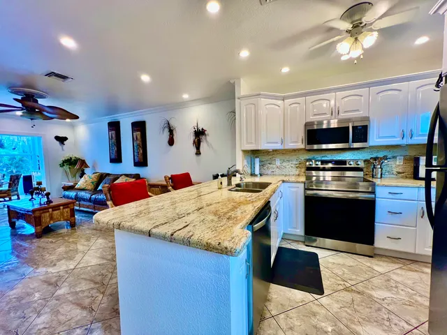 a balcony with table and chairs