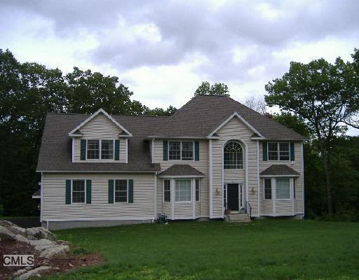 8 Grace Moore Road Newtown, CT 06482 - Photo 1 of 1 a front view of a house with a garden