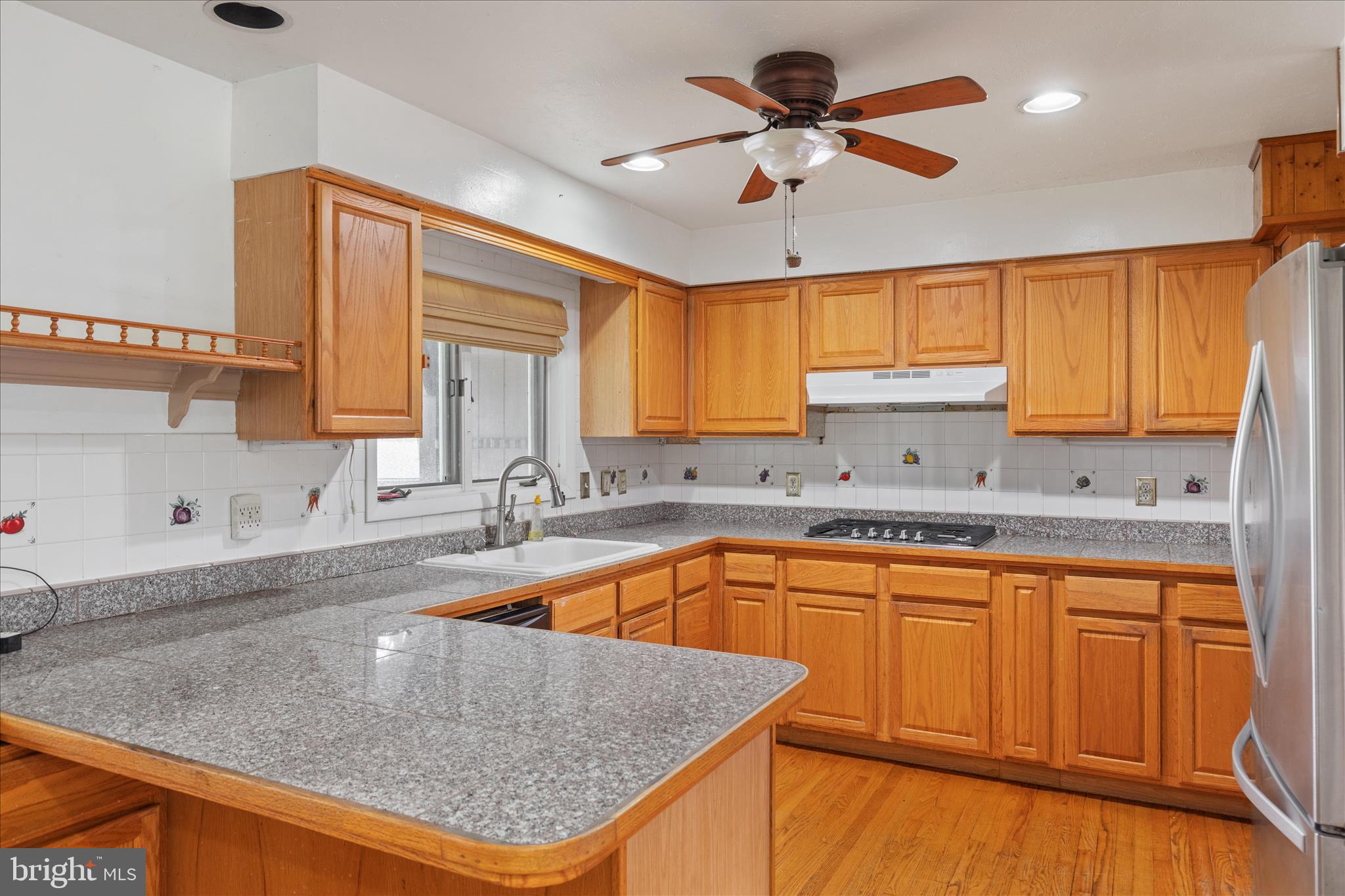 263 Bowling Green Road Front Royal, VA 22630 - Photo 22 of 75 a kitchen with stainless steel appliances granite countertop a sink a window and cabinets