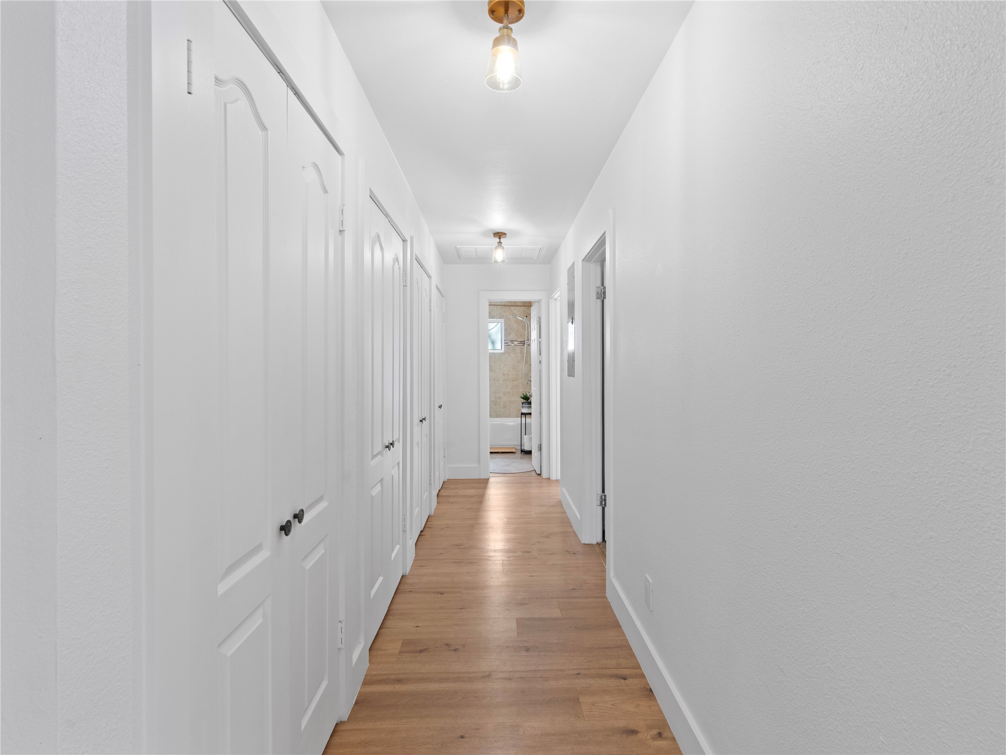 5108 Sioux Lane Austin, TX 78734 - Photo 13 of 35 a view of a hallway with wooden floor