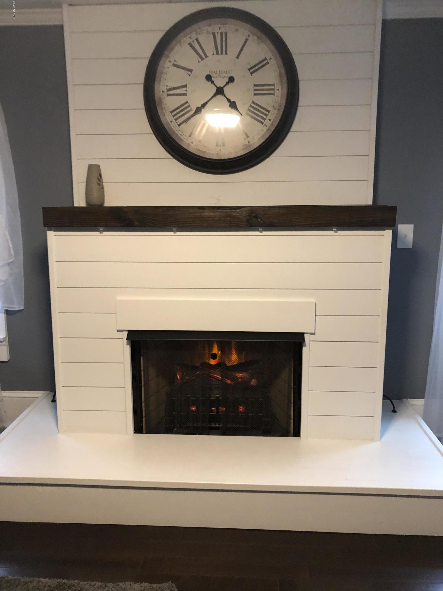 4410 Pigott Road Southwest Shallotte, NC 28470 - Photo 14 of 15 This is a functional electric fireplace