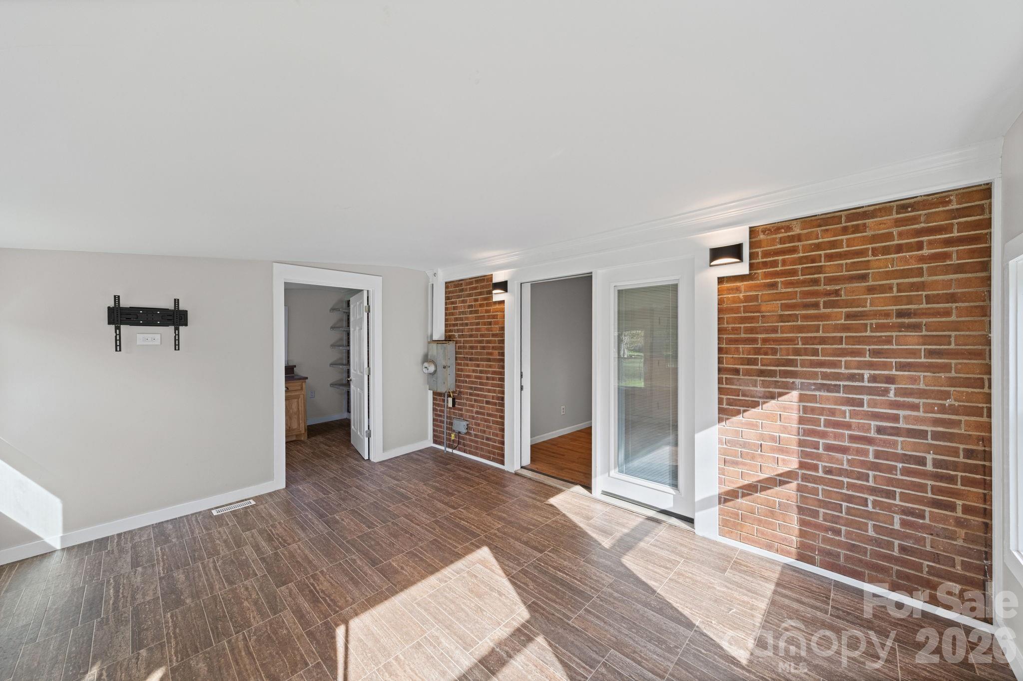 3227 Westover Road Statesville, NC 28677 - Photo 21 of 37 a view of empty room with wooden floor and cabinet
