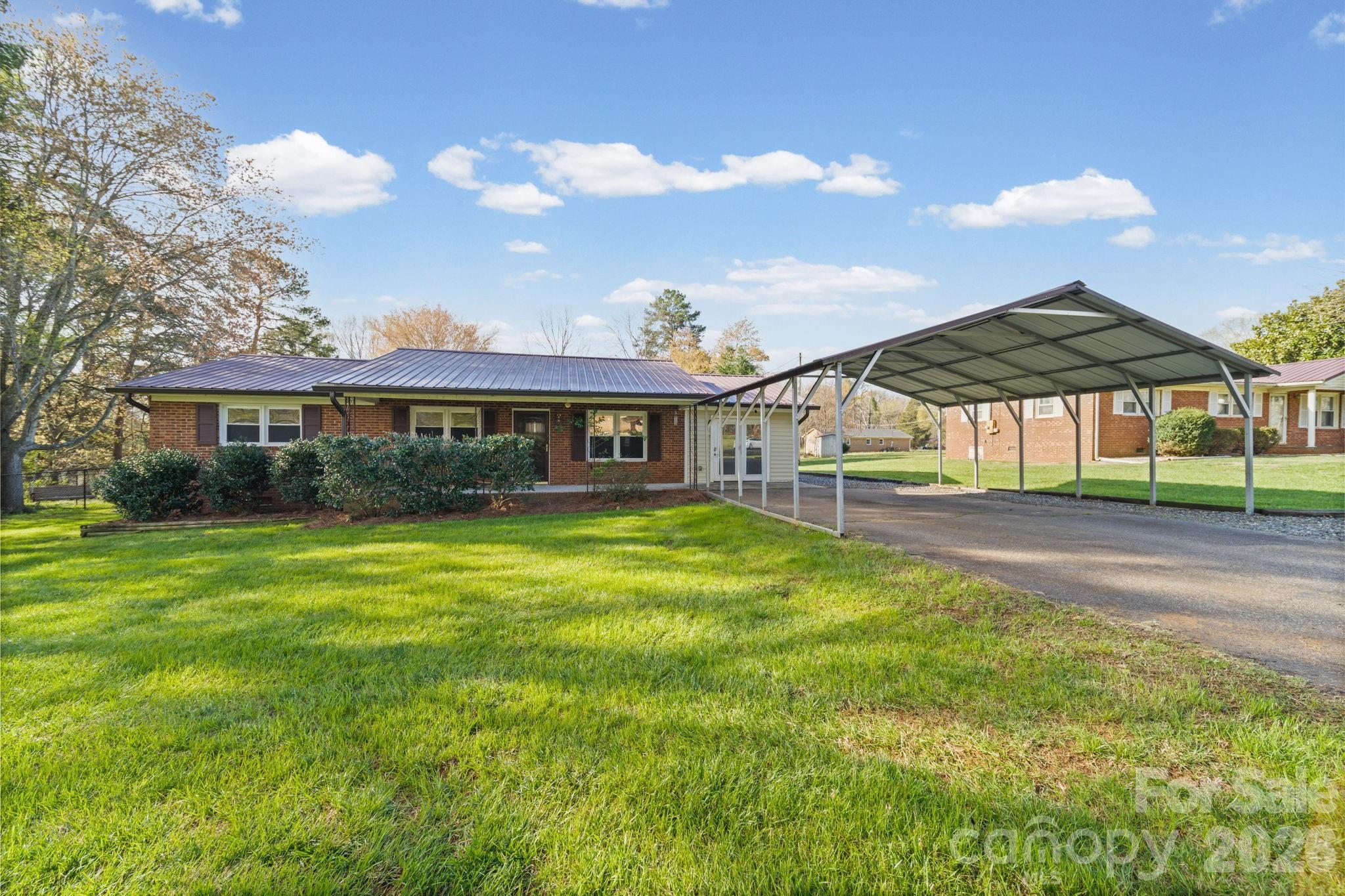 3227 Westover Road Statesville, NC 28677 - Photo 26 of 37 a view of a house with a yard