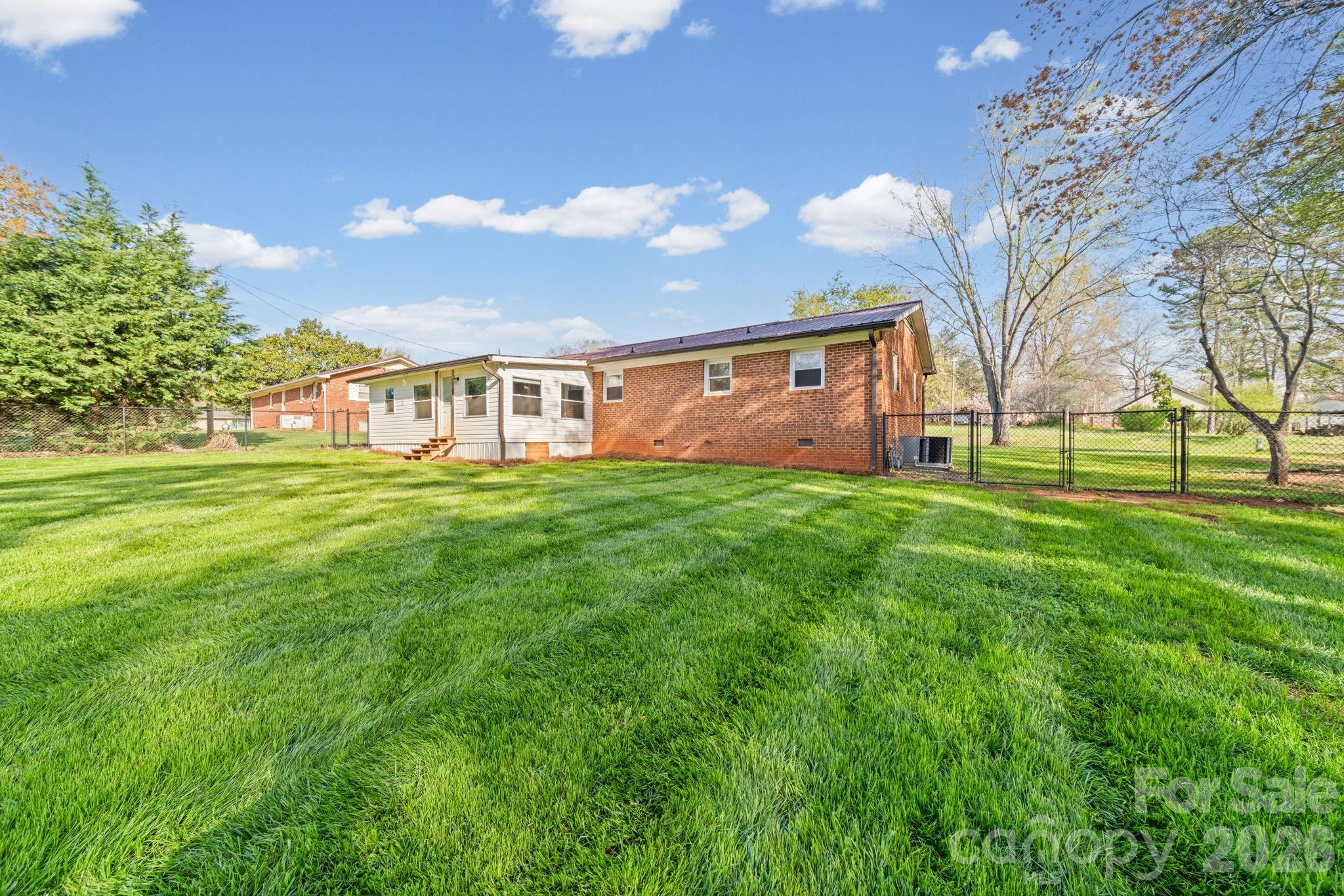 3227 Westover Road Statesville, NC 28677 - Photo 29 of 37 a view of a house with a big yard and large trees