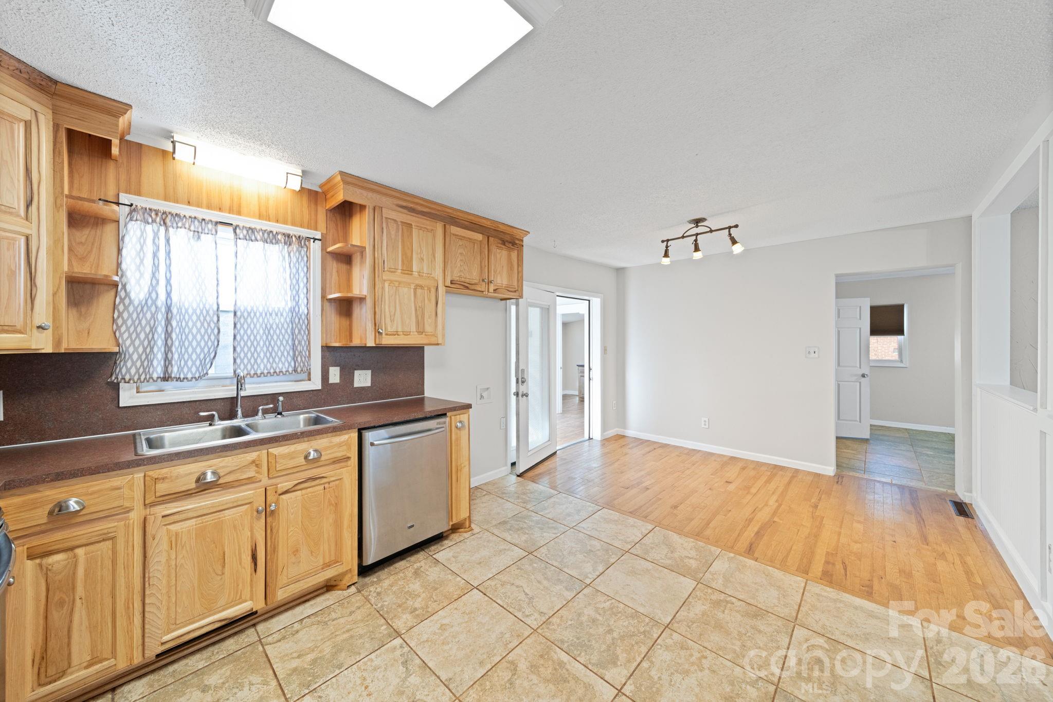 3227 Westover Road Statesville, NC 28677 - Photo 7 of 37 a open kitchen with a sink and cabinets