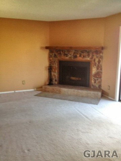 2721 Patterson Road, Unit 802 Grand Junction, CO 81506 - Photo 2 of 12 an empty room with a fireplace