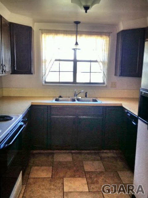 2721 Patterson Road, Unit 802 Grand Junction, CO 81506 - Photo 3 of 12 a kitchen with a sink a window and cabinets