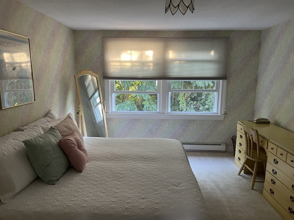 15 Leo Road Marblehead, MA 01945 - Photo 13 of 21 a bedroom with a bed and a window