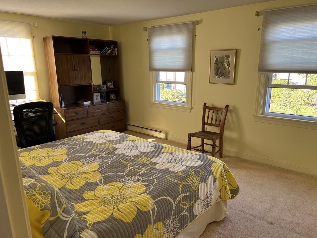 15 Leo Road Marblehead, MA 01945 - Photo 14 of 21 a bedroom with a bed and a chair