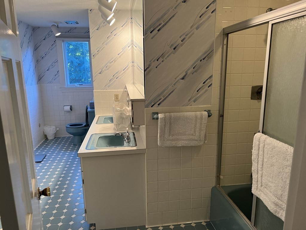 15 Leo Road Marblehead, MA 01945 - Photo 15 of 21 a bathroom with a sink and mirror
