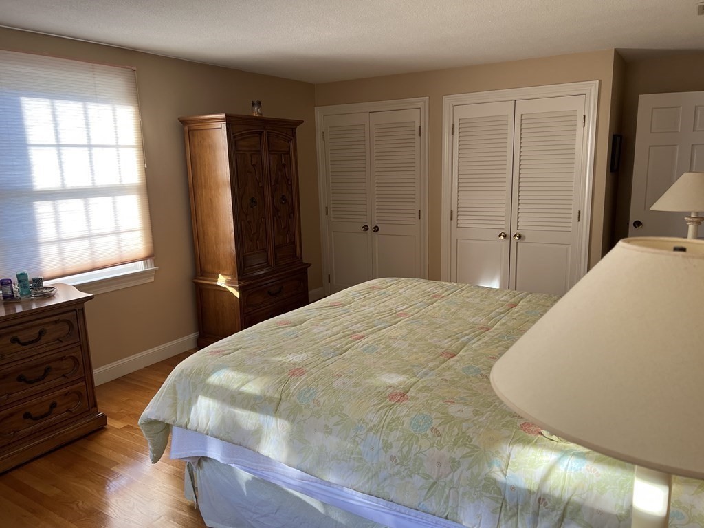 15 Leo Road Marblehead, MA 01945 - Photo 16 of 21 a bedroom with a bed and wooden floor