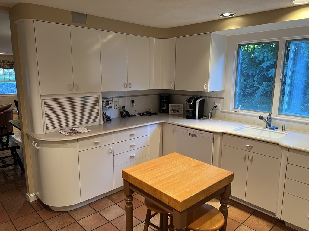 15 Leo Road Marblehead, MA 01945 - Photo 6 of 21 a kitchen with a sink a stove and cabinets
