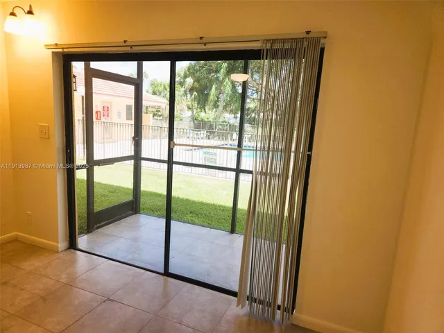 a view of a room with a large window