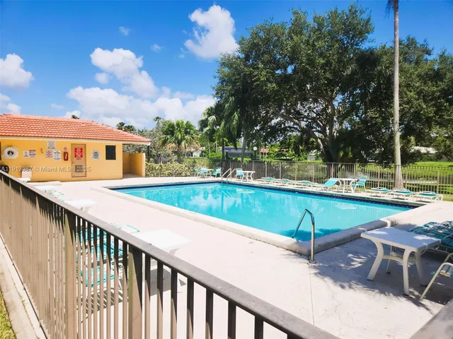 a view of a swimming pool with a patio