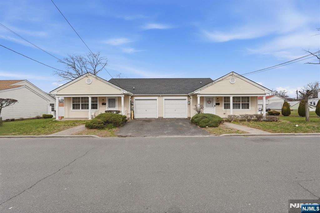 120 Carnegie Place Union, NJ 07088 - Photo 1 of 28 a front view of a house with a yard