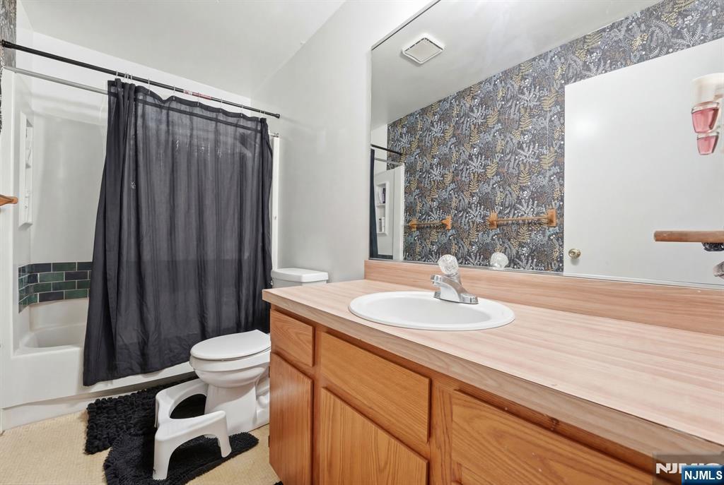 120 Carnegie Place Union, NJ 07088 - Photo 12 of 28 a bathroom with a sink a toilet a mirror and shower