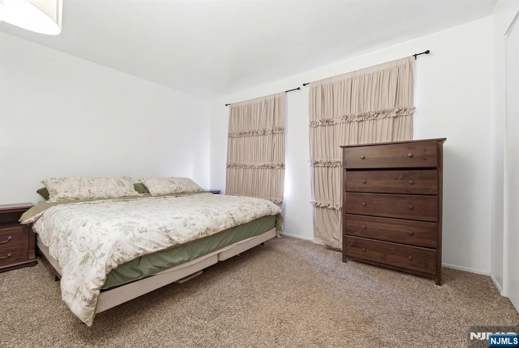 120 Carnegie Place Union, NJ 07088 - Photo 13 of 28 a bedroom with a bed and a dresser