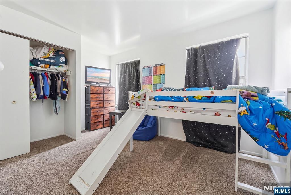 120 Carnegie Place Union, NJ 07088 - Photo 18 of 28 a room that has a bed and a desk in it