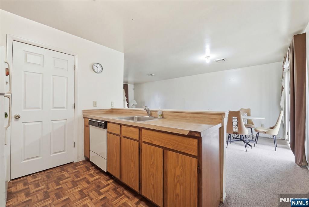 120 Carnegie Place Union, NJ 07088 - Photo 5 of 28 a room with a sink a table and chairs
