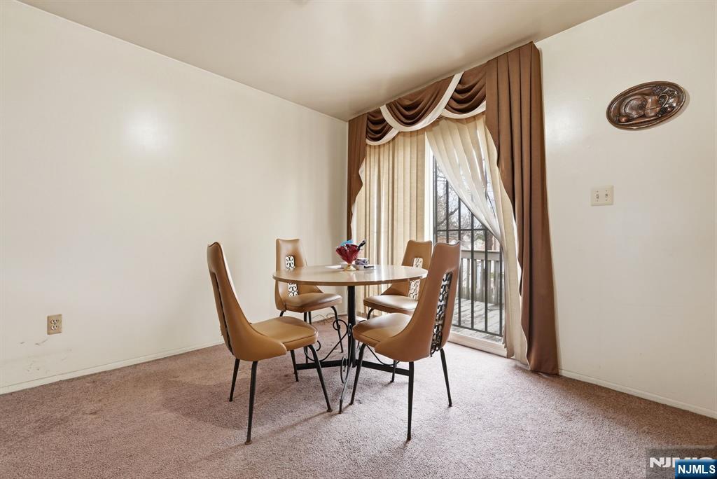 120 Carnegie Place Union, NJ 07088 - Photo 6 of 28 a view of a dining room with furniture and a window