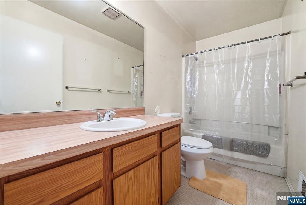 120 Carnegie Place Union, NJ 07088 - Photo 9 of 28 a bathroom with a sink a toilet and shower
