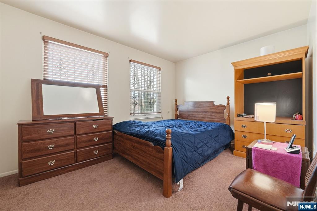 120 Carnegie Place Union, NJ 07088 - Photo 10 of 28 a bedroom with a bed and a television