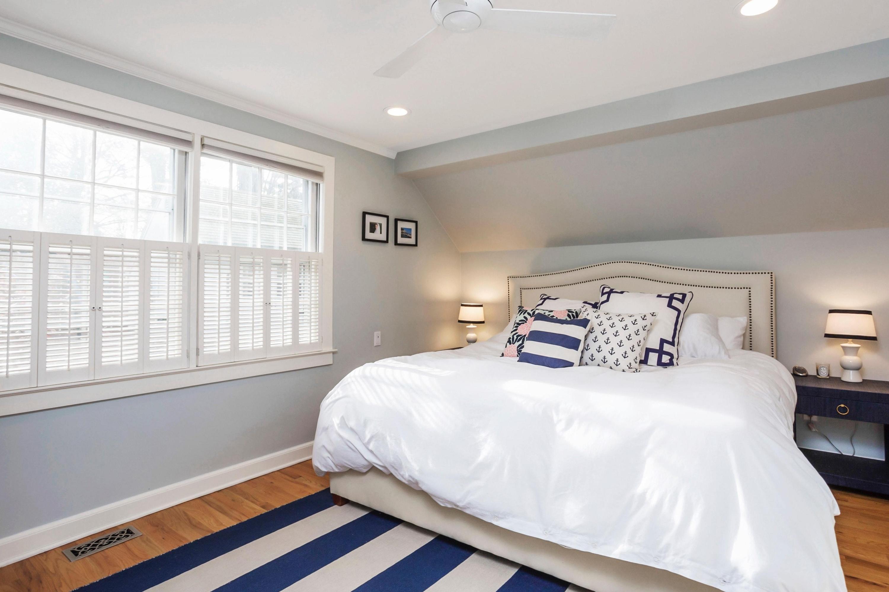 204 Middlesex Road Darien, CT 06820 - Photo 11 of 23 a bedroom with a bed and wooden floor