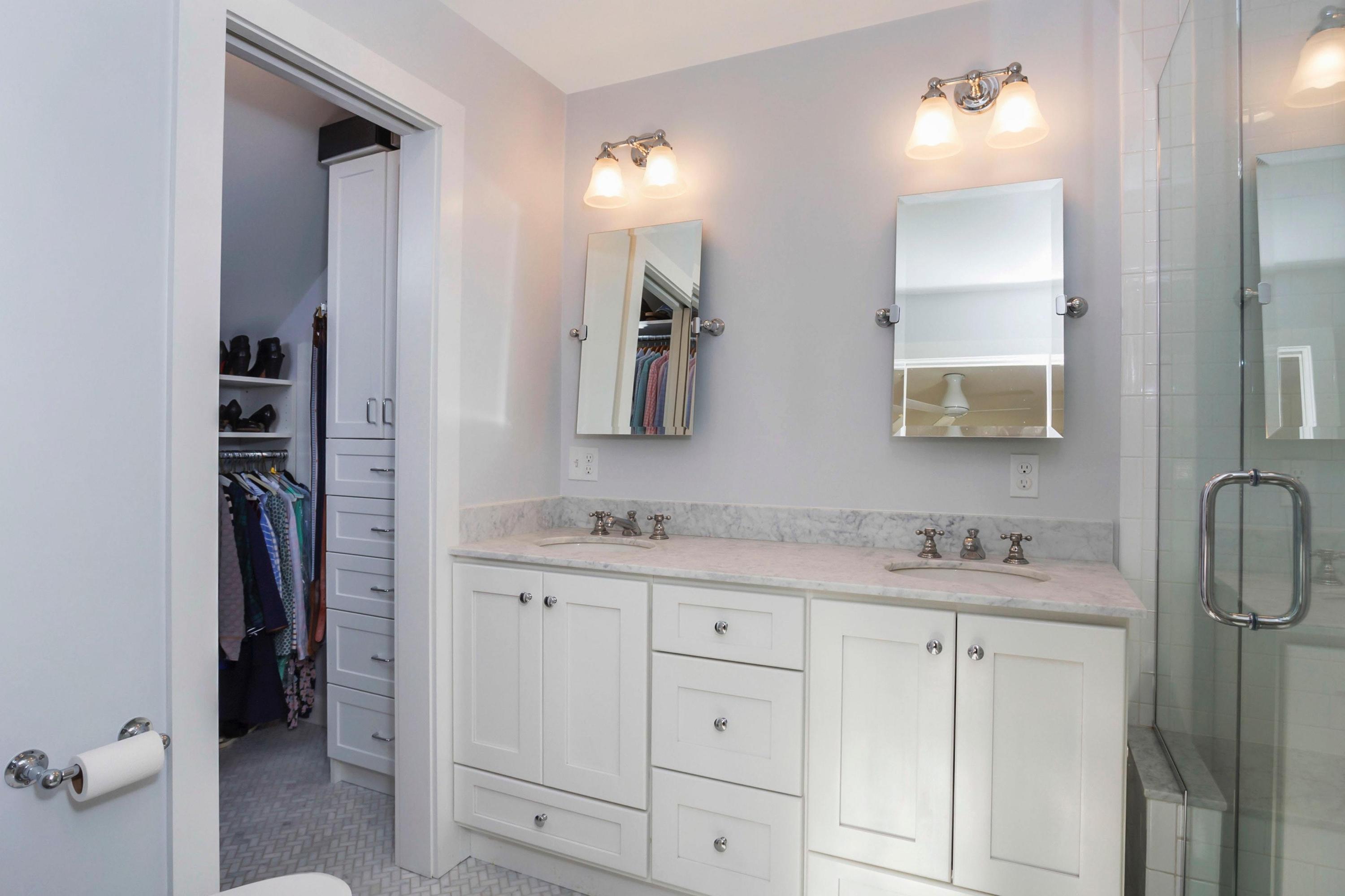 204 Middlesex Road Darien, CT 06820 - Photo 13 of 23 a bathroom with a sink vanity and a mirror