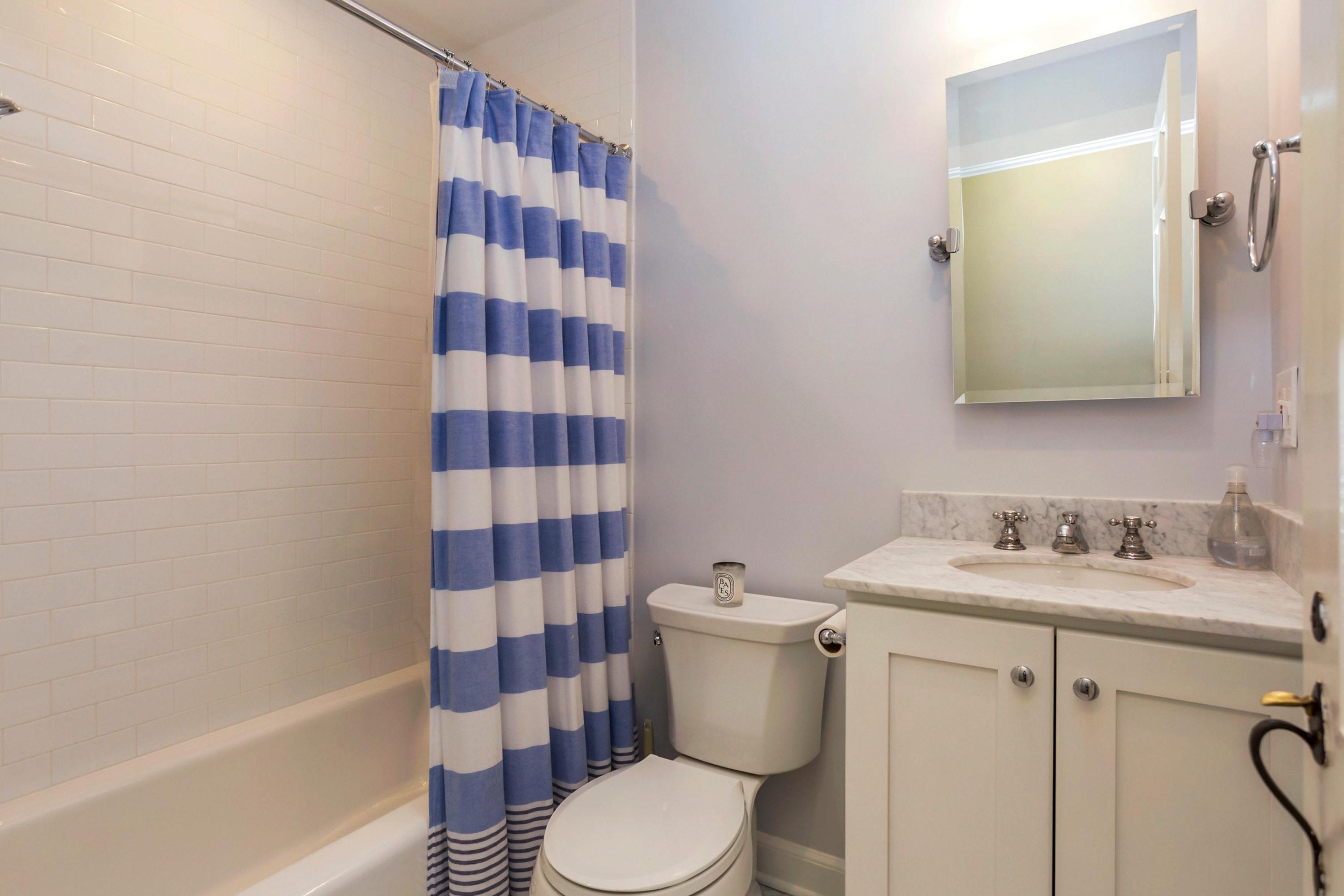 204 Middlesex Road Darien, CT 06820 - Photo 17 of 23 a bathroom with a sink toilet and shower