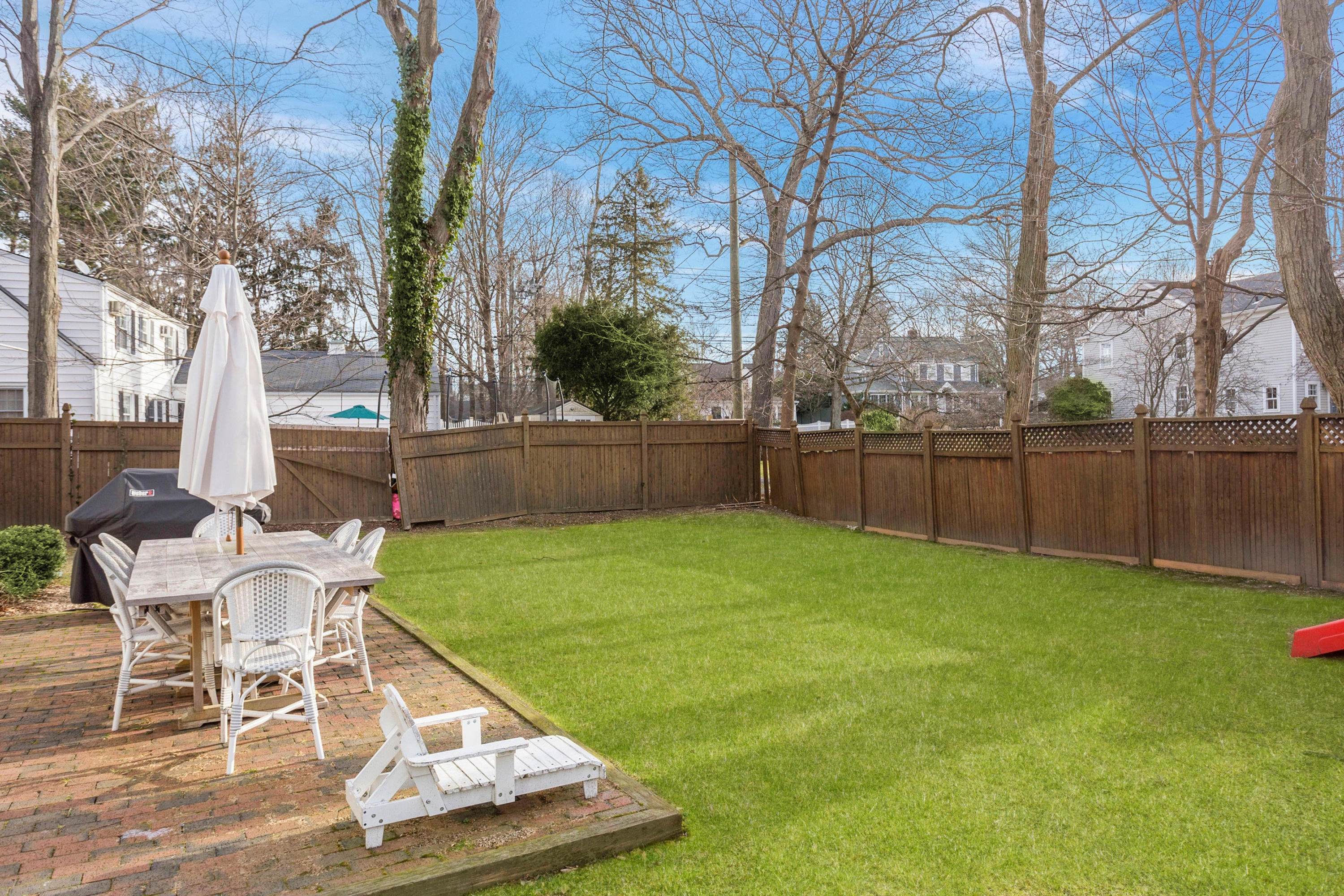 204 Middlesex Road Darien, CT 06820 - Photo 18 of 23 a view of backyard with seating and green space