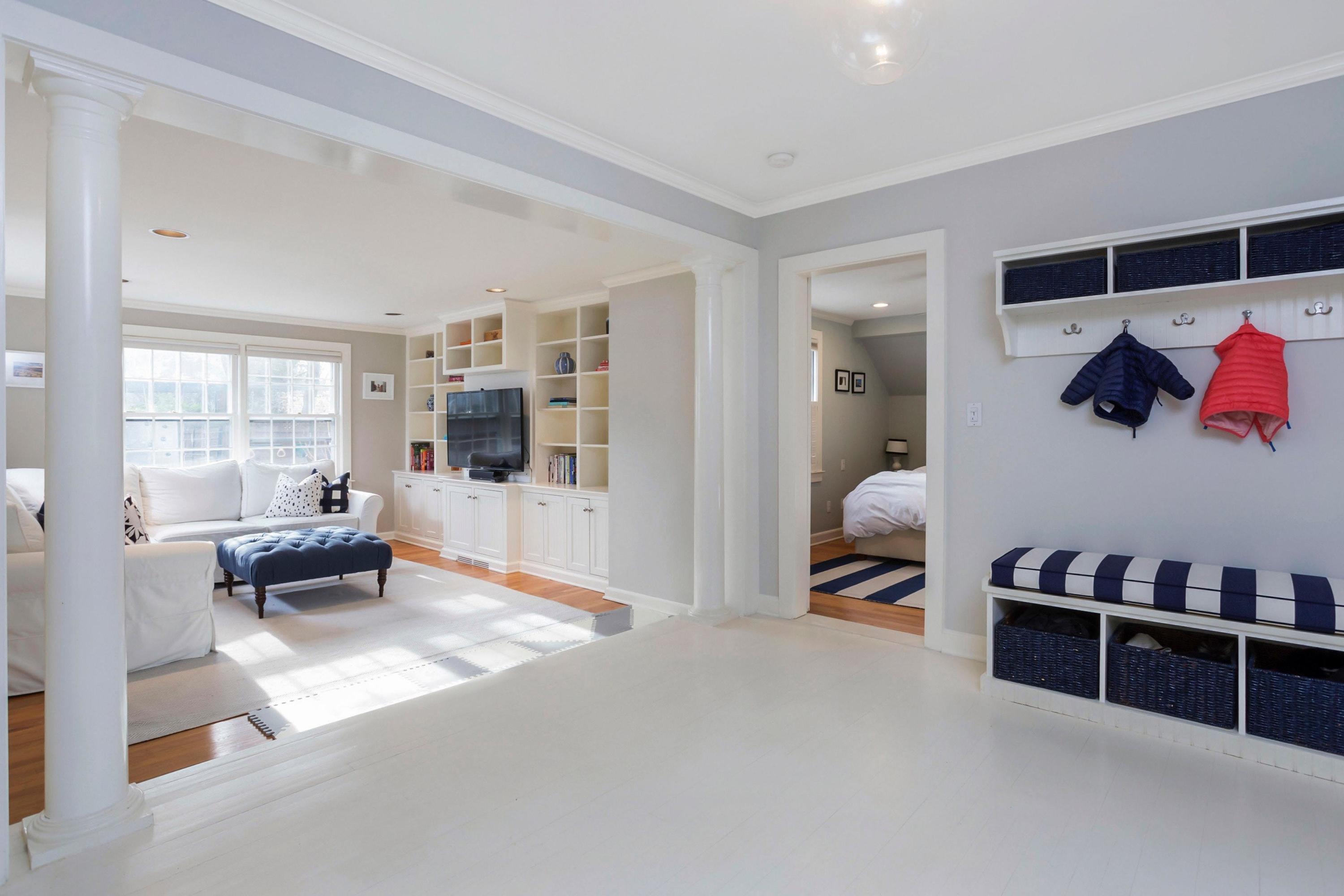 204 Middlesex Road Darien, CT 06820 - Photo 3 of 23 a bedroom with furniture and a book shelf