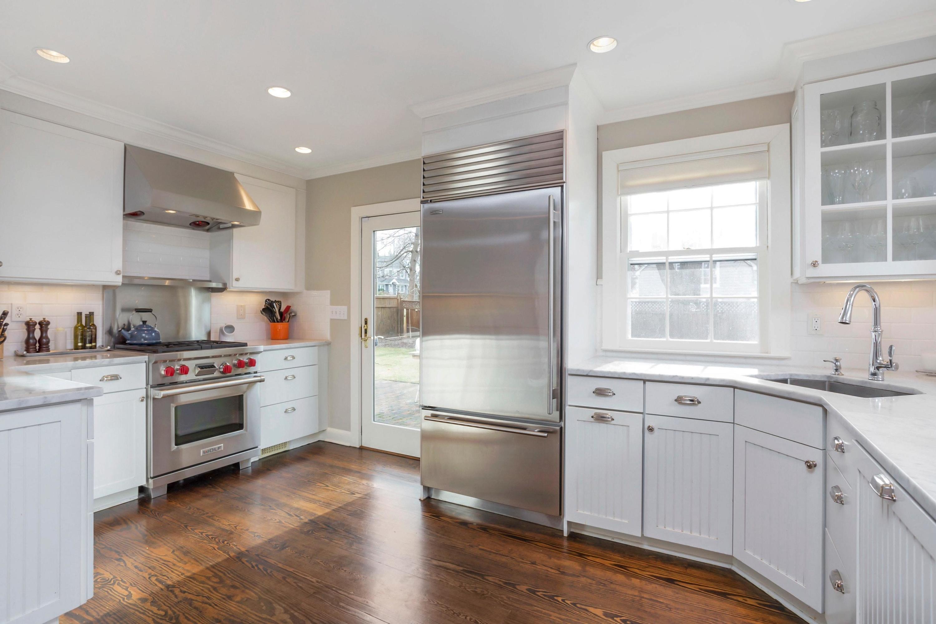 204 Middlesex Road Darien, CT 06820 - Photo 8 of 23 a kitchen with a refrigerator and a sink